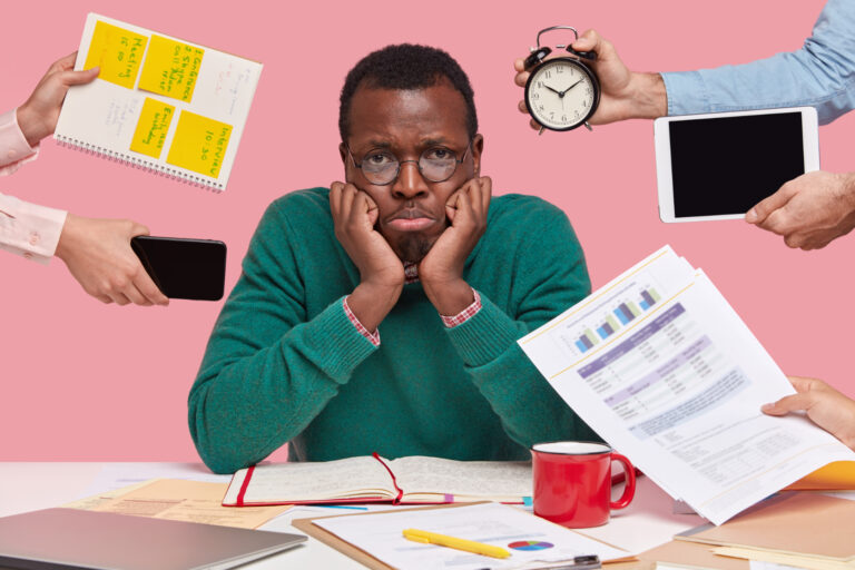 upset black male worker has much work thinks about business project being lack time 1